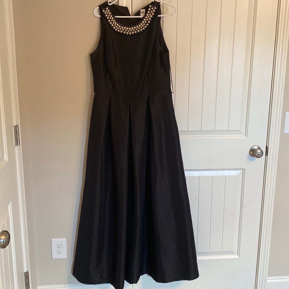 Floor length black gown with pearl details